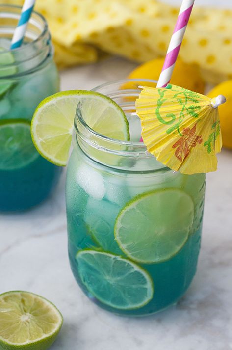 Mermaid Water Rum Punch Cocktail will make you feel like you're on a tropical island and perfect for a hot summer day. Multiply the ingredients to make a big batch for your next party or picnic! Rum Punch Cocktail, Tropical Drink Recipes, Wild Theme, Mermaid Water, Pitcher Drinks, Pitcher Cocktails, Tropical Cocktails, Punch Cocktails, Cocktail Pitcher