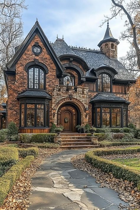 Brick house with arched windows and stone pathway. Ever wondered what it’s like to live in a fairy tale, fireplaces crackling and turrets gleaming, without eating enchanted apples or dodging mischievous dwarves? Fairytale Home Floor Plans, Gothic Architecture House Exterior, Brick House In The Woods, Gothic Stone House, Rivendell Inspired Home, Houses With Turrets, Stone Victorian House, Brick House Floor Plans, Castle Like Homes