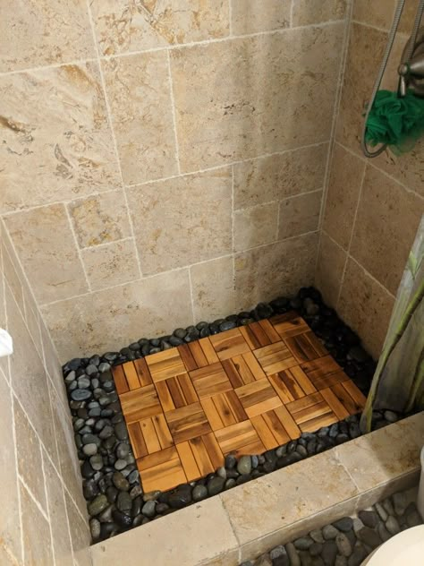 Cheap shower remodel. Bought some wooden deck tiles and river rocks to give it a more natural feel Diy Zen Bathroom Ideas, Bathroom Ideas Japanese Style, Bathroom Rock, Rocks In Bathroom, Zen Shower Ideas, River Rock Shower Ideas, Rocks For Shower Floor, Shower River Rock Floor, Stone Bathroom Ideas Rocks