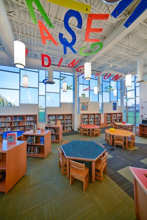 The Mineola UFSD approached H2M with the idea of creating a new, state-of-the-art library addition suited to the Pre-K through second students attending it's Hampton Street Elementary School. The new building is a modern approach to library science, with an integrated library/media center. The space incorporates cheerful colors, small furniture, and expansive windows to allow natural light to flood the space. School Library Design, Preschool Designs, Science Design, Library Media Center, Elementary School Library, Community Library, Elementary Library, School Interior, Interior Design School