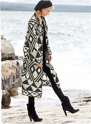 Black and white and gorgeously graphic, the artsy, double-faced knit coat in baby alpaca (70%) and wool (30%) is patterned with African geometrics. Long, easy and simply modern with patch pockets, turn-back cuffs and minimally styled buttonless placket. Traditional Long Sleeve Alpaca Outerwear, Folk Style Long Sleeve Outerwear With Geometric Embroidery, Peruvian Textiles Long Sweater, Geometric Coat, White Long Jacket, Multicolor Folk Outerwear With Geometric Embroidery, Multicolor Geometric Pattern Long Sleeve Outerwear, Black And White Coat, Alpaca Coat