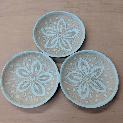 #WIP Turquoise plates with sgraffito carved flower design. Easy Sgraffito Designs, Ceramics Platter Ideas, Sgraffito Plate Designs Easy, Sgraffito Designs Easy, Sgraffito Plate Designs, Sgraffito Coasters, Scrafitto Ceramics Plates, Sgraffito Designs Plates, Sgraffito Designs