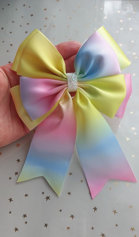 1 x  Satin Double Bow  Colour - rainbow/ glitter trim Listing is for 1 Single Bow, please choose feature from drop down list Measures about 14 x 18 cm, please allow 1-3mm error due of being hand crafted  Made of 50 mm ribbon  Beautiful handmade bow, ideal for Wedding, Christening, Anniversary , Graduation, Birthday Party decorations, decorating gifts,  Craft projects , sewing and much more Make a beautiful touch on a present for a friend or  loved one , decorate your wedding stationery, favour b Christening Party, Flower Cup, Gift Wrapping Bows, Rainbow Glitter, Glitter Bow, Handmade Bows, Pastel Rainbow, Ribbon Bows, Party Gifts