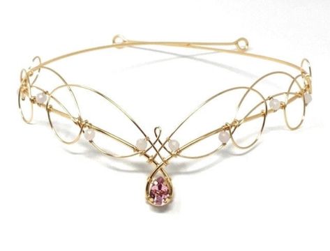 Gold and pink Celtic Elven style tiara with rose Quartz gemstones and a central premium pear shaped crystal in the centre. Quartz Tiara, Wedding Circlet, Elven Wedding, Tiara Headpieces, Unusual Weddings, Celtic Knot Designs, Gold Tiara, Celtic Wedding, Crystal Tiaras