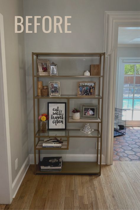 Modern bookcase with decorative items Bookshelf With Picture Frames, Bookcase With Picture Frames, Bookshelf With Family Photos, How To Display Family Photos On Book Shelves, Bookshelves With Baskets, Bookshelves With Picture Frames, Baskets On Bookshelves, Picture Frames On Bookshelves, Bookcase Photo Display