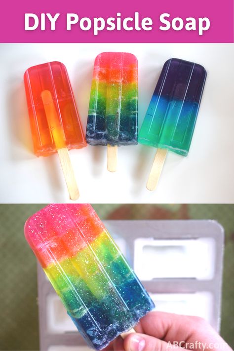 Three colorful and rainbow soaps that look like popsicles and then another image holding a glitter rainbow popsicle soap by the popsicle stick. Text above reads "DIY Popsicle Soap" Handmade Soap Recipes Melt And Pour, Popsicle Soap Ideas, Melt And Pour Soap Embeds, Glycerin Melt And Pour Soap Ideas, Soap Popsicles, Clear Melt And Pour Soap Ideas, Diy Melt And Pour Soap, Melt And Pour Soap Ideas, Cosmetic Chemistry