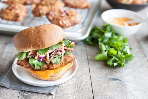 Korean Fried Chicken Sandwich | BourbonandHoney.com -- This Korean Fried Chicken Sandwich is spicy, flavorful and delicious. Topped with a kimchi slaw and gochujang aioli, it's irresistible! Gochujang Aioli, Korean Fried Chicken Sandwich, Kimchi Slaw, Gochujang Recipe, Sandwich Buns, Cabbage Kimchi, Sandwich Wraps Recipes, Sambal Oelek, Spicy Korean