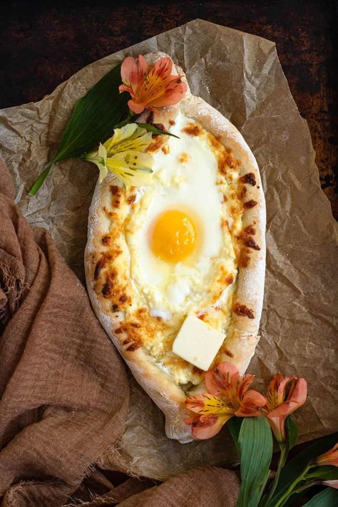 This authentic Khachapuri is a deliciously cheesy flatbread topped with a slightly runny egg that is perfect as a side or brunch. Cheesy Flatbread, Authentic Breakfast, Eggs For Brunch, Turkish Eggs, Dried Dill, Runny Eggs, Homemade Spice Blends, Food Aesthetics, National Dish