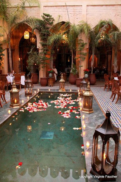 Marrakech pool adorned with customary wedding decor of brass lanterns, luminous candles, and floating flower petals [photo by Virginie Faucher, Paris, France].... Riad Marrakech, Balkon Decor, Casa Country, Moroccan Wedding, Floating Flowers, Pool Design, Moroccan Decor, Moroccan Style, Indoor Pool