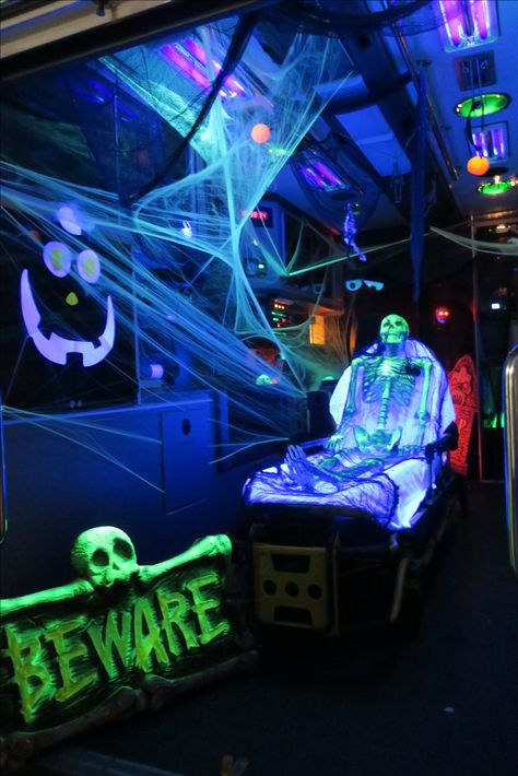 Spooky Ambulance with Skeleton and black lights for Halloween. Wlvac Trunk Or Treat Black Light, Black Light Trunk Or Treat Ideas, Trunk Or Treat Ambulance, Trunk Or Treat Ideas For Ambulance, Haunted Trailer Ideas, Black Light Trunk Or Treat, Skeleton Trunk Or Treat Ideas, Hogwarts Halloween, Monster Mash Party