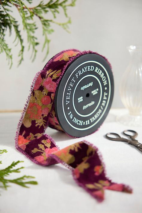 Topped with romantic florals, this terrain exclusive velvet ribbon makes a sumptuous finishing touch for gifts and décor alike. | Floral Velvet Ribbon in Purple, Size: Medium at Terrain Moody Christmas, Snow Crafts, Fall Ribbon, Burgundy Ribbon, Floral Products, Handmade Felt Ornament, Acts Of Service, Wrapping Ribbon, Ribbon Skirt