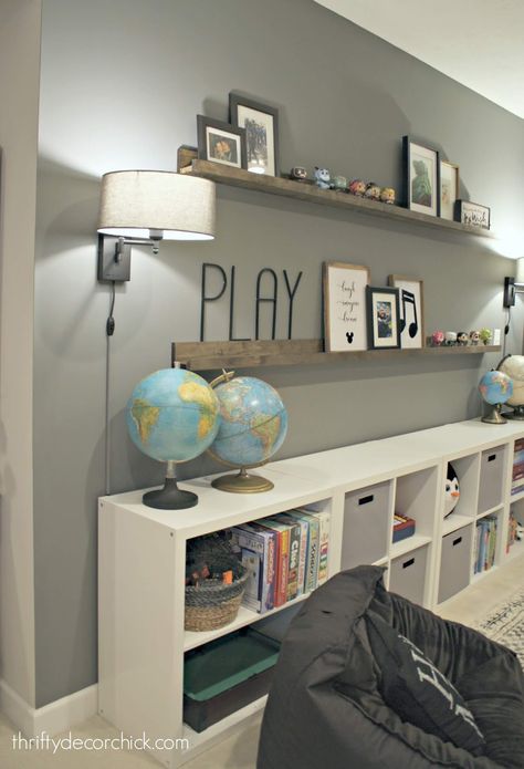 HUGE empty wall transformed into pretty game and toy storage! from Thrifty Decor Chick Toy Storage For Living Room, Toy Organization Living Room, Living Room Toy Storage, Ikea Toy Storage, Organize Toys, Diy Toy Storage, Toy Storage Solutions, Thrifty Decor Chick, Basement Storage