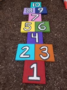 DIY Backyard Hopscotch made from Pavers Backyard Hopscotch, Hopscotch Ideas, Kids Garden Play Area, Outdoor Playscapes, Kids Outdoor Playground, Outdoor Kids Play Area, Play Area Backyard, Backyard Kids Play Area, Kids Outdoor Play