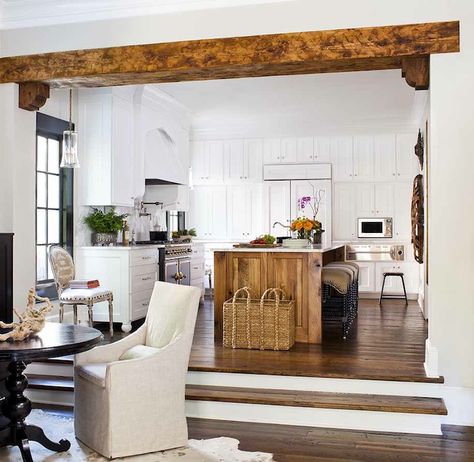 Kitchen opens to sunken dining room with rustic wood beam with corbels featuring glossy black pedestal table with natural linen slipcovered ... 1900s Home, Transitional Dining Room, Sunken Living Room, Kitchen Views, Wood Beams, Traditional Kitchen, Contemporary Kitchen, Open Concept, Kitchen Renovation