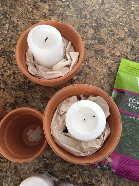 I used these super easy and inexpensive candle holders as part of a Spring/Easter tablescape a few years back, and I still love them today! Step 1: Dry brush your terra cotta pots with white paint! You can add as much or as little paint as you like here. rush your paint in one direction, preferably around your pot (not up and down). Step 2: Place a small piece of masking tape over the holes in your pots – this is just to help keep any moss from falling through and out onto your tab… Terra Cotta Candle Holder, Making Candle Holders, Egg Shell Planters, Anthropologie Candle, Small Terracotta Pots, Terra Cotta Pots, Faux Brick Walls, Diy End Tables, Picture Shelves