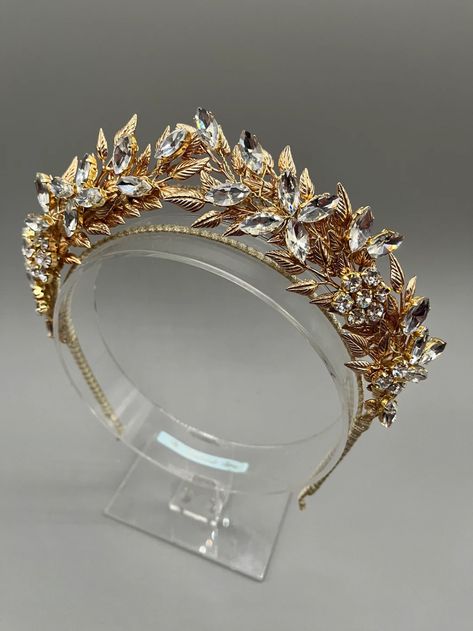 This Tiaras item is sold by TheHandmadeTiara. Ships from United Kingdom. Listed on Jun 9, 2023 Golden Laurel Crown, Fantasy Gold Crown Headpiece, Golden Vine Crown, Greek Golden Leaf Crown, Silver Leaf Headband, Gold Leaf Tiara Wedding, Jewelled Headpiece, Gold Leaf Crown, Tiara Headpieces