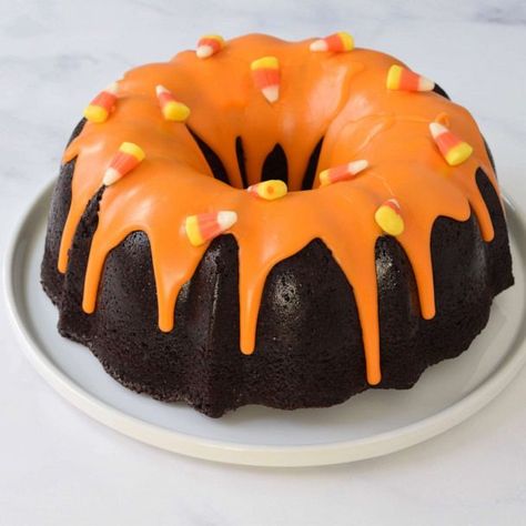 Spice up Halloween with this chocolate bundt cake with candy corn glaze | GMA Bundt Cake Decorations, Mini Bunt Cake, Spice Bundt Cake, Corn Cake, Chocolate Bundt, Baking Stuff, Spiced Chocolate, Mini Bundt Cakes, Torte Cupcake