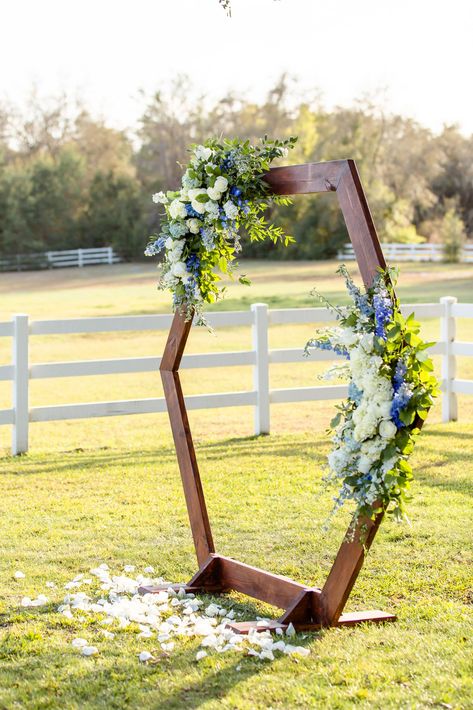 Hexagon Wedding Arch With Flowers, White And Blue Wedding Arch, Hexagon Wedding Arch Floral, Hexagon Wedding Arch Flowers, Hexagon Wedding Arch Flowers Under Pavilion, Spring Wedding Arch, Hexagon Wedding Arch White Flowers, Blue Wedding Arch, Beach Wedding Hexagon Arch