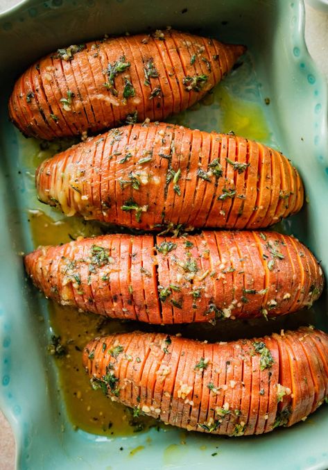 Best Hasselback Sweet Potatoes Recipe (with Maple Syrup) a delightful addition to your holiday table or any meal- herbs, garlic, butter, and maple! Hassleback Sweet Potatoes, Scalloped Sweet Potatoes, Hasselback Sweet Potatoes, Sweet Potatoes Recipe, Sweet Potato Recipe, Sweet Potato Slices, Hasselback Potatoes, Savory Herb, Infused Olive Oil