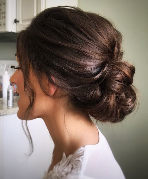 Loose Wedding Hair Updo, Bridal Mid Updo, Bridal Elegant Updo, Junior Bridesmaid Updo, Low Bun For Bride, Med Length Hairstyles For Wedding, Dark Brown Hair Updo, Bridal Updo Side Part, Wedding Updo Messy