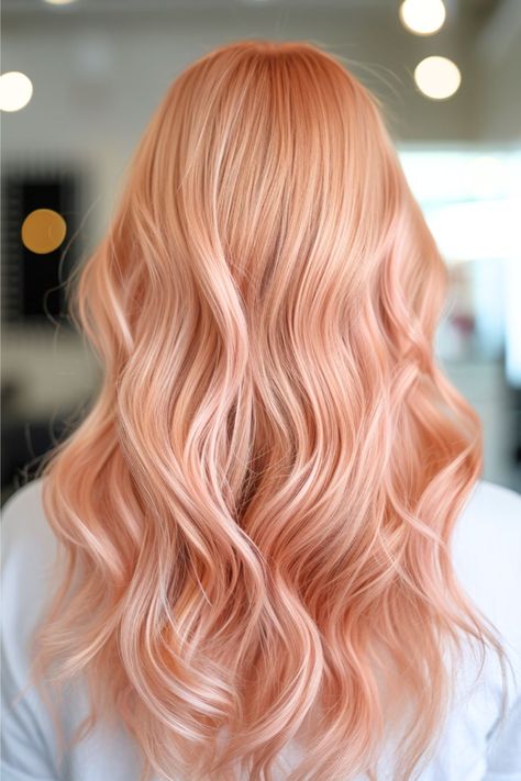 These waves flow with the soft, luxurious luster of rose gold, striking a perfect balance between pink and golden hues. The gentle waves add a romantic flair, evoking the delicate petals of a rose. It’s an elegant and trendy color that exudes warmth and sophistication. Click here to see more stunning red hair color ideas. Strawberry Milk Hair Color, Pinkish Ginger Hair, Apricot Hair Color Peach Rose Gold, Strawberry Blonde Hair Color Rose Gold, Blonde Peach Hair, Peach Hair Color Rose Gold, Peach Color Hair, Cute Hair Colours, Peachy Blonde Hair