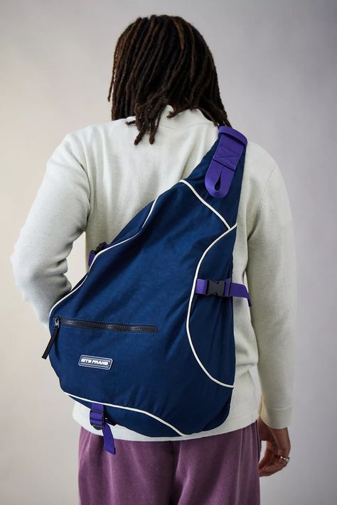 Carry your essentials in this handy backpack by iets frans... in a casual sling style. Triangular bag Ft. a single adjustable webbing shoulder strap, zip-up fastening to the side, an extra pocket to the front for keeping your valuables close at hand and a logo detail to the exterior. Only at Urban Outfitters. Sling Backpack, Zip Up, Urban Outfitters, Zip Ups, Shoulder Strap, Backpacks, Exterior, Purple