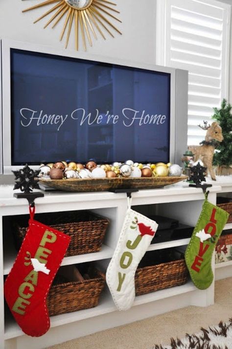 Dress up your media center for the holidays with your Christmas stockings. Elegant Christmas Decorations, Hanging Christmas Stockings, Christmas Decorations Apartment, Natural Christmas Decor, Elegant Christmas Decor, Christmas Apartment, Apartment Decoration, Natural Christmas, Gorgeous Christmas