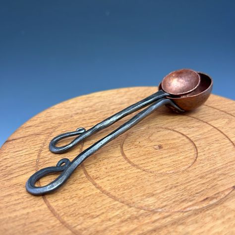 Coffee scoop/tablespoon and teaspoon Reclaimed copper and steel Handforged #blacksmith #blacksmithing #handforged #forged #handhammered #copper #coppersmith #coppersmithing #artisan #artisanmade #metalwork #metalworking #spoon #scoop #coffeescoop #tablespoon #teaspoon #kitchengoods #kitchenware #kitchentools #handmade #handmadewithlove #handmadegifts Coffee Scoop, Hand Forged, Blacksmithing, Cool Kitchens, Metal Art, Metal Working, Copper, Handmade Gifts