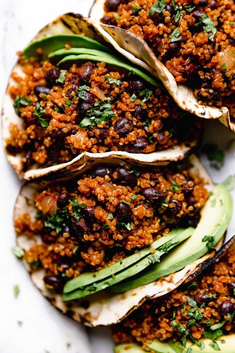 Quinoa Black Bean Tacos with Cilantro Lime Crema – Your new favorite vegan taco recipe! Easy vegan tacos made with hearty black bean quinoa taco meat. This easy taco recipe comes together in 30 minutes or less. It's made with pantry staples. Naturally vegetarian vegan, dairy-free, gluten-free. #playswellwithbutter #vegetariantacos #blackbeantacos #tacotuesday #vegantacos #plantbasedrecipesforbeginners #plantbasedmeals #plantbaseddinner #veganrecipes #vegandinner Quinoa Taco Meat, Cilantro Lime Crema, Plantbased Dinner, Vegan Tacos Meat, Quinoa Tacos, Bean Quinoa, Lime Crema, Vegan Taco, Veggie Tacos