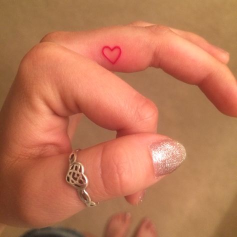 Tiny pink heart Pink Heart Finger Tattoo, Hot Pink Heart Tattoo, Hot Pink Tattoo, Pink Heart Tattoo, Pink Tattoo Ink, Lifeline Tattoos, Side Finger Tattoos, Heart Tattoo Ankle, Heart Tattoo On Finger