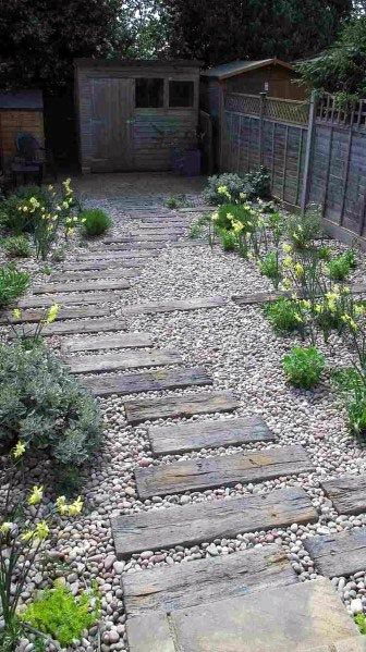 Top 50 Best Wooden Walkway Ideas - Wood Path Designs Garden With Gravel, Wellness Sanctuary, Stone Garden Paths, Pebble Garden, Ancient Healing, Walkway Landscaping, Medicinal Garden, Walkways Paths, Gravel Garden