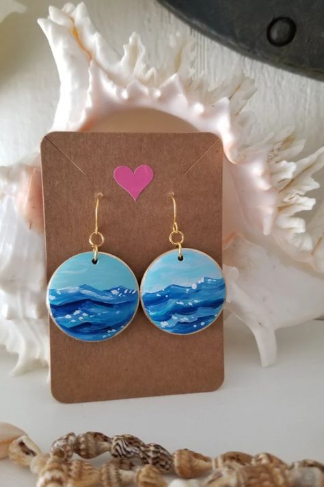 Photo shows a pair of round wood disc hand painted earrings with blue waves.  Gold tone ear wires and gold leaf trim. Measure 1.25" across. Unique Hand-painted Jewelry For Beach, Mdf Earrings Hand Painted, Chain Painting, Mdf Earrings, Wooden Handpainted Earrings, Hand Painted Earrings Wood, Diy Crafts Earrings, Artistic Hand-painted Blue Earrings, Fabric Jewellery