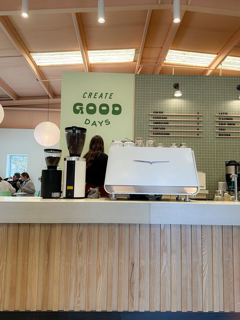 Smoothie Bowl Cafe Interior, Green Coffee Shop Design, Coffee Shop Merchandise Display, Green Bakery Aesthetic, Retro Coffee Shop Aesthetic, Green Coffee Shop Interiors, Sage Green Cafe Aesthetic, Sage Green Coffee Shop, Green Coffee Aesthetic