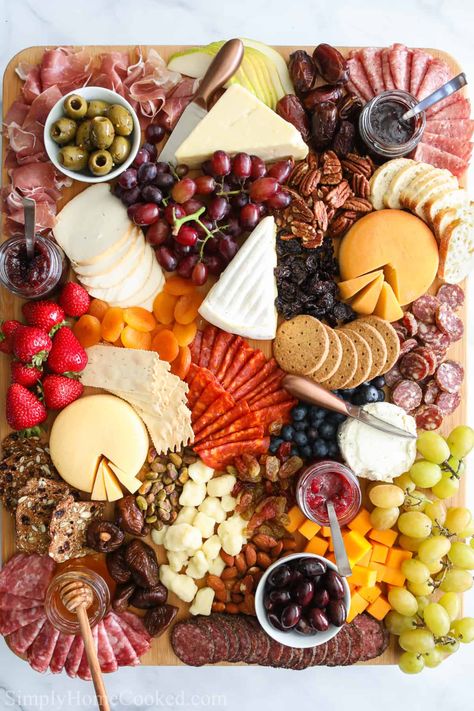 Ultimate Charcuterie Board with an assortment of meats, cheeses, fruit, nuts, bread, crackers, olives, jams, and honey. Bread Crackers, Charcuterie Board Meats, Whole Wheat Crackers, Dessert Inspiration, Picnic Photoshoot, Charcuterie Board Ideas, Charcuterie Inspiration, Charcuterie Platter, Charcuterie Cheese