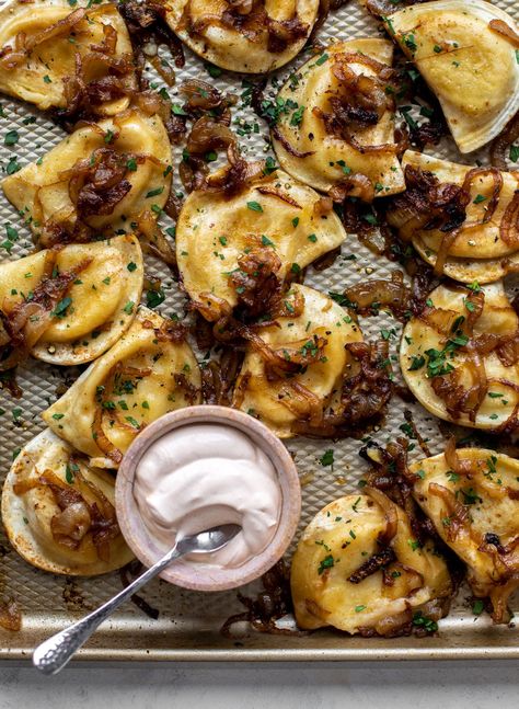 These sheet pan pierogies are the easiest ever! Throw frozen pierogies on a sheet pan with some onions and you're good to go. Yum! Great for an appetizer or side for dinner. Sheet Pan Pierogies, Chipotle Sour Cream, Frozen Pierogies, Perogies Recipe, Pierogi Recipe, Sweet Onions, Adobo Sauce, Sheet Pan Meals, Polish Food