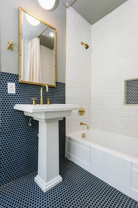 Gold and blue bathroom theme features a Kohler Tresham Pedestal Sink with brass accents. Penny Tile Bathroom, Blue Penny Tile, Penny Tiles Bathroom, Bathroom Tiles Combination, Blue Bathrooms Designs, Navy Bathroom, Tiled Bathroom, Ceramic Pedestal, Trendy Bathroom Tiles