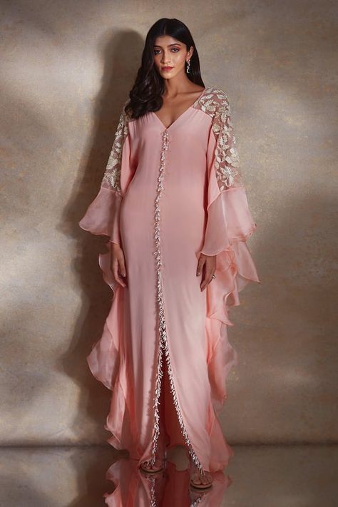 Peach kaftan featuring bead and pearl tassels along the bodice, floral sequin embroidered sheer shoulder panels and ruffle tiered sleeves. - Aza Fashions Peach Crepes, Pearl Tassels, Kaftan Designs, Kaftan Style, Winter Sun, Simple Pakistani Dresses, Abaya Designs, Arab Fashion, Coral Dress