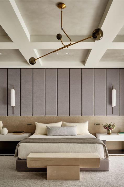 Primary bedroom; custom bed; upholstered walls; coffered ceiling; modern minimal; Workshop/APD transformed this exceptional double-wide Upper East Side townhouse’s interiors from a stylistically disjointed mash-up to a cohesive, inviting primary residence for a young family. Large-scale elements like a dangling, five-story custom chandelier at the core of its elegant central staircase bring drama and intrigue to a light, bright material and color palette. Coffered Ceiling Lighting, Modern Coffered Ceiling, Low Ceiling Bedroom, Upper East Side Townhouse, Custom Bed Frame, Coffered Ceiling Design, Workshop Apd, Townhouse Interior, Upholstered Walls