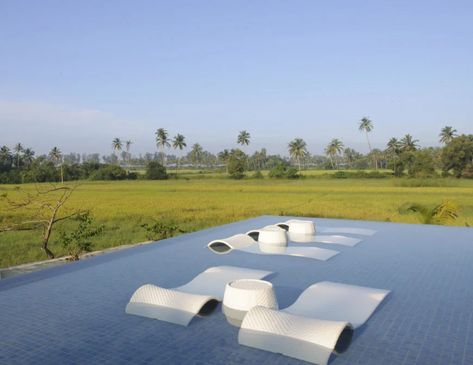 This example of a shallower pool has rolling, modern style lounge chairs, perfect for sunbathing while staying cool. The pool overlooks a meadow. Diy Shallow Pool, Pools With Waterfalls, Shallow Pool, Pool Chaise, Endless Pool, Pools Backyard Inground, Pool Lounge Chairs, Natural Waterfalls, Waterfall Pictures