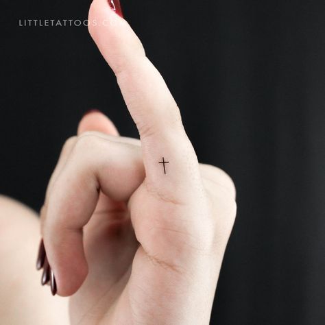 Set of three minimalist Christian cross temporary tattoos. Powerful and ancient, the cross is a symbol that is easily recognizable around the world. While this symbol predates the Christian religion, today it is most commonly associated with Christianity. It’s a popular motif in tattoo design, especially for those looking for a special way to deepen their relationship with God. Our tiny minimalist cross temporary tattoo is perfect for those who prefer a small and simple design. When it comes to Small Jesus Tattoo, Tattoos Powerful, Jesus Tattoos, Tiny Cross Tattoo, Fingerprint Tattoos, Cross Tattoo On Wrist, Small Cross Tattoos, Finger Tattoos For Couples, Simple Cross Tattoo