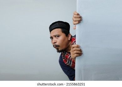 Curious Man Peeking Behind Wall Stock Photo 2155863251 | Shutterstock Peeking Behind Wall Pose, Person Peeking Around Corner, Hiding Something Behind Back Pose, Curious Pose Reference, Peeking Around Corner, Portait Pose, Poem Illustration, Corner Drawing, Curious People