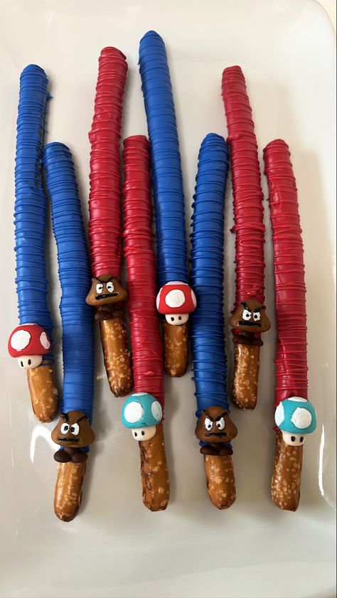 Super Mario Chocolate Covered Pretzels, Mario Pretzel Rods, Mario Chocolate Covered Pretzels, Super Mario Pretzels, Super Mario Chocolate Covered Strawberries, Super Mario Pretzel Rods, Mario Pretzels, Super Mario Bros Treats, Super Mario Strawberries