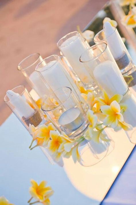 Tropical frangipani wedding decorations Fiori Frangipani, Wedding Decorations Candles, Frangipani Wedding, Fiji Wedding, Reception Centerpieces, Flowers Ideas, Hawaiian Wedding, Wedding Table Decorations, Wedding Mood Board