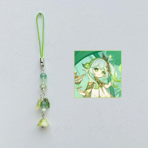 Nahida phone charm with green quartz, prehnite and angelite 🌱 ★彡[ꜱʜᴏᴘ ʟɪɴᴋ ɪɴ ʙɪᴏ]彡★ Handmade with ʀᴇᴀʟ ᴄʀʏꜱᴛᴀʟꜱ. ˚ ༘♡ ⋆｡˚𝓲𝓰𝓷𝓸𝓻𝓮 𝓽𝓱𝓮 𝓽𝓪𝓰𝓼 ˚ ༘♡ ⋆｡˚ #genshin #genshinimpact #genshinimpactedit #genshinimpactfanart #genshinimpactmihoyo #mihoyo #hoyolab #handmade #beads #explore #explorepage #navia #yaemiko #raidenshogun #hutao #fyp #phonecharm #phonestrap #smallbiz #smallbusiness #beads #xiao #furina #xianyun #neuvillette #venti #nahida #zhongli #kazuha Genshin impact phone charms Beads Phone Charms, Self Business, Kazuha Genshin, Bead Charms Diy, Phone Charms, Handmade Wire Jewelry, Green Quartz, Beaded Keychains, Bead Shop