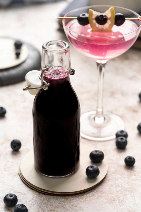 This Blueberry Simple Syrup Recipe is made with blueberries, sugar, and water to flavor cocktails, lemonade, iced tea, and more! Use fresh or frozen blueberries in this homemade syrup recipe. Make the best drink recipes and including Italian sodas and homemade seltzers with this fruit simple syrup. Blueberry Syrup Recipe Easy, Christmas Morning Mimosa, Simple Syrup For Cocktails, Huckleberry Recipes, Blueberry Syrup Recipe, Blueberry Drinks, Italian Sodas, Blueberry Simple Syrup, Simple Syrup Cocktails