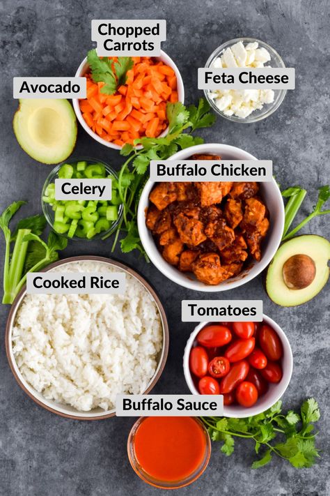 A tangy hot sauce coating protein-packed chicken, along plenty of fresh veggies and garnished with creamy feta and avocado all over a bed of fluffy white rice. This Buffalo Chicken Rice Bowl is a hearty meal, perfect for meal prep, that you're going to want to make again and again. Buffalo Chicken Bowl, Buffalo Chicken Bowls, Buffalo Chicken Rice Bowl, Feta And Avocado, Buffalo Chicken Rice, Buffalo Chicken Celery, Fluffy White Rice, Chicken Rice Bowl, Creamy Feta