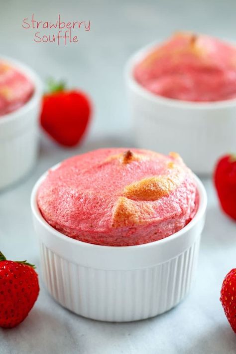 Head-on view of strawberry souffle in white ramekin with strawberries and additional souffles in background and "Strawberry Souffle" text at top Souffle Recipes Easy, Ramekin Dessert, Strawberry Souffle, Ramekin Recipe, Light Summer Desserts, Tiramisu Dessert, Souffle Recipes, Dessert For Two, Chocolate Delight