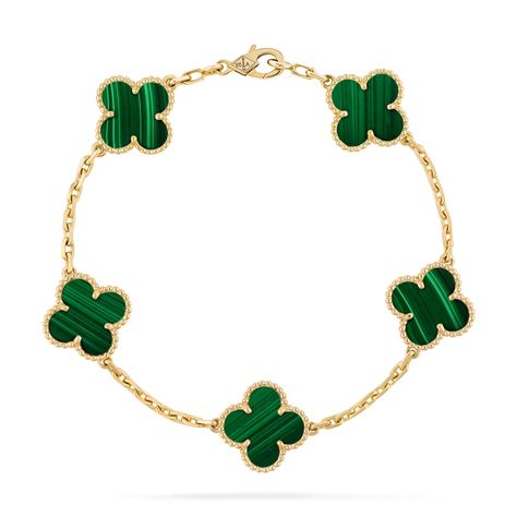 Faithful to the very first Alhambra® jewel created in 1968, the Vintage Alhambra creations by Van Cleef & Arpels are distinguished by their unique, timeless elegance. Inspired by the clover leaf, these icons of luck are adorned with a border of golden beads. Vintage Alhambra bracelet, 5 motifs, 18K yellow gold, malachite. Malachite Van Cleef, Van Cleef Bracelet Gold, Van Cleef Malachite, Van Cleef Bracelet, Vintage Alhambra Bracelet, Alhambra Bracelet, Classy Purses, Van Cleef And Arpels Jewelry, Golden Beads