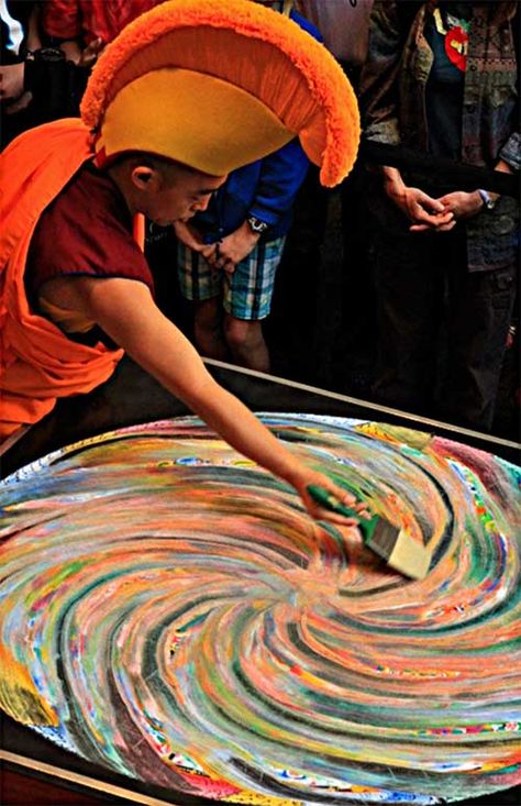 The Buddhist monks create sand works like this one as a form of meditation, drizzling the sand out from small metal funnels. The image incorporates icons that include geometric shapes and ancient spiritual symbols. A ceremony celebrated the completion of the sacred mandala, and ended with a monk wiping the sand away – a symbol of the impermanence of things. Soul Images, Mandala Buddha, Sand Mandala, Sacred Mandala, Tibetan Mandala, Tibetan Monk, Siddhartha Gautama, Buddhist Monks, Buddhist Practices