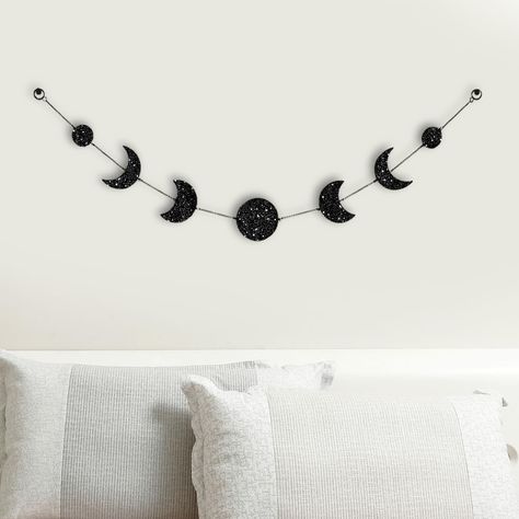 PRICES MAY VARY. Moon Phase Wall Hanging Art: this boho moon phase garland is made of black metal chain and quality acrylic with silver glitter, protected with transparent films on the front and back to protect from scratches, and came with 2 hooks to hang to the wall. Please remove the film of the surface of the moon when using. Spiritual Moon Wall Hanging Decor: this sparkling lunar inpired decor is inspired by the changes of phases of the moon, just as our brand name 'RTMISA' comes from the a Moon Phase Garland, Lunar Art, Moon Phase Wall Hanging, Black Room Decor, Hanging Boho Decor, Halloween Bedroom Decor, Halloween Bedroom, Casa Halloween, Dorm Living Room